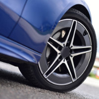 detail photo of blue car and rim