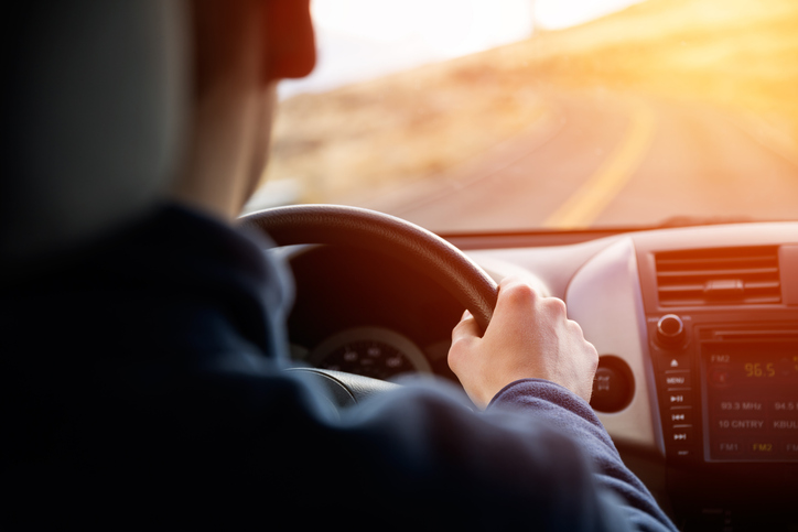 driving car in sunset