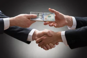 handshake with money