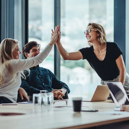 High five at a dealership extended warranty sales meeting