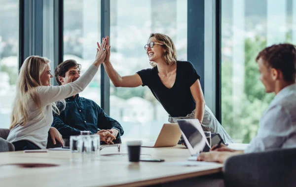 High five at a dealership extended warranty sales meeting